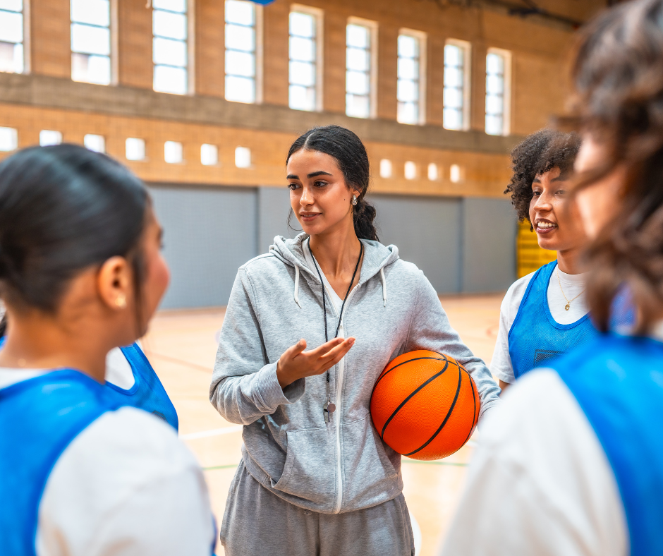 Basket tränare med sina spelare